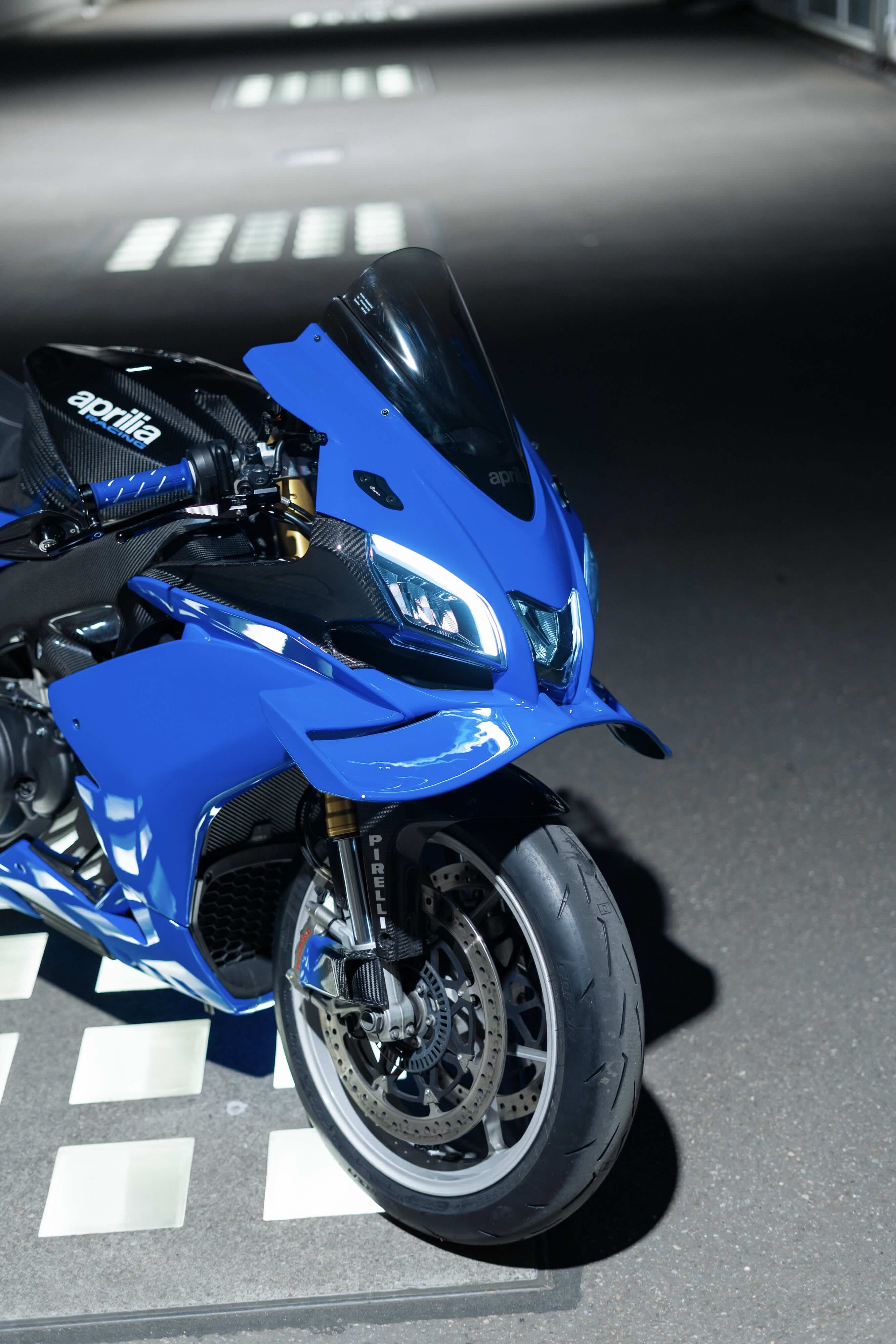Blue motorcycle on a checkered floor
