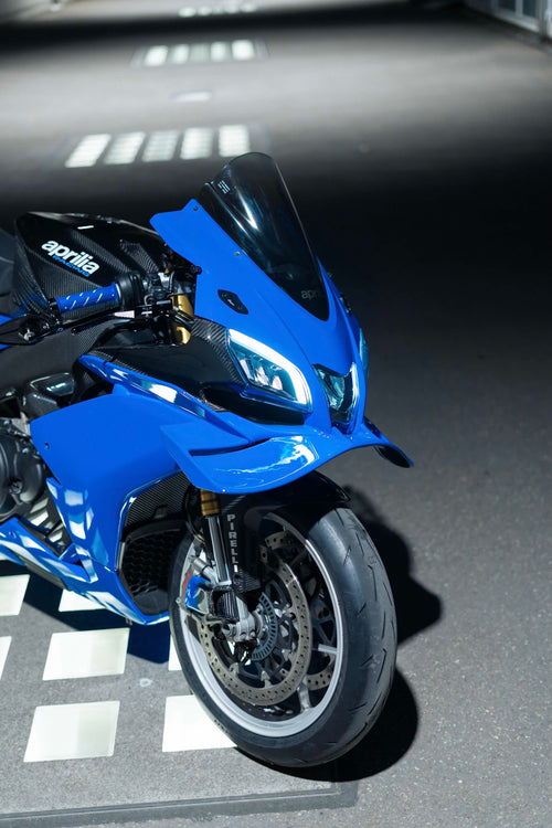 Blue motorcycle on a checkered floor