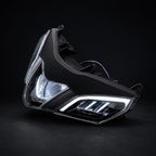 Motorcycle headlight on a black background