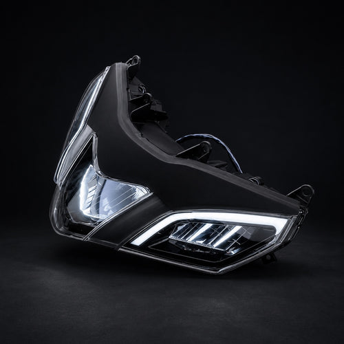 Motorcycle headlight on a black background